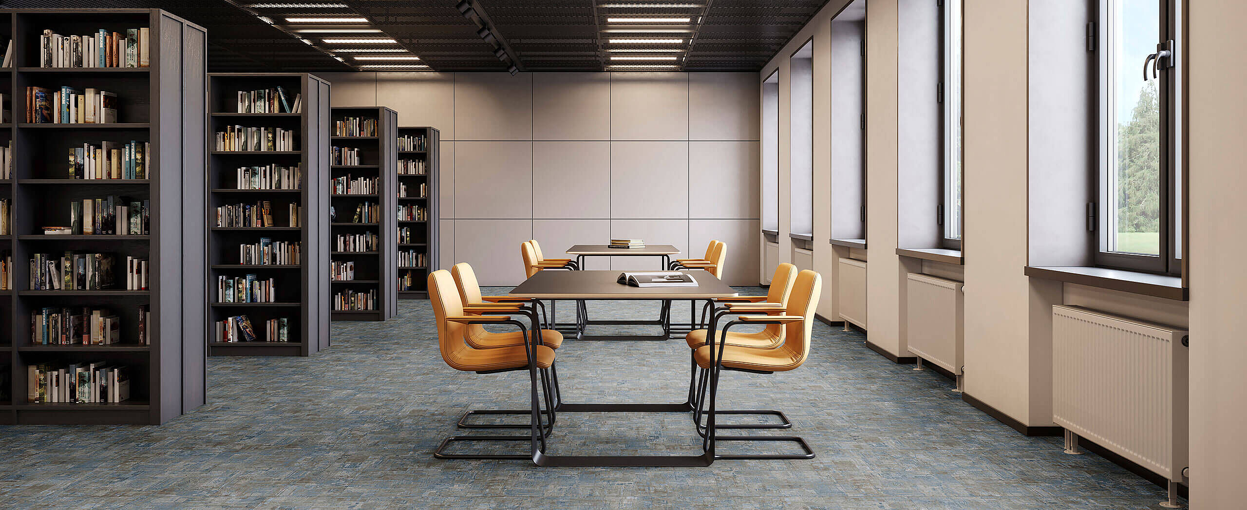 Leseraum mit Bücherregalen, Tischen und gelben Stühlen auf recyceltem Elastikboden in blau-grauer, melierter Fliesenoptik.